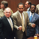 O.J. Simpson listens to the not-guilty verdict with his attorneys F. Lee Bailey (left) and Johnnie Cochran on Oct. 3, 1995.
MYUNG J. CHUN/AFP/Getty Images